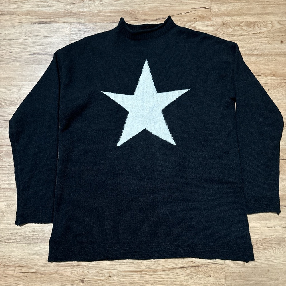 Women's black knitted sweater with white star